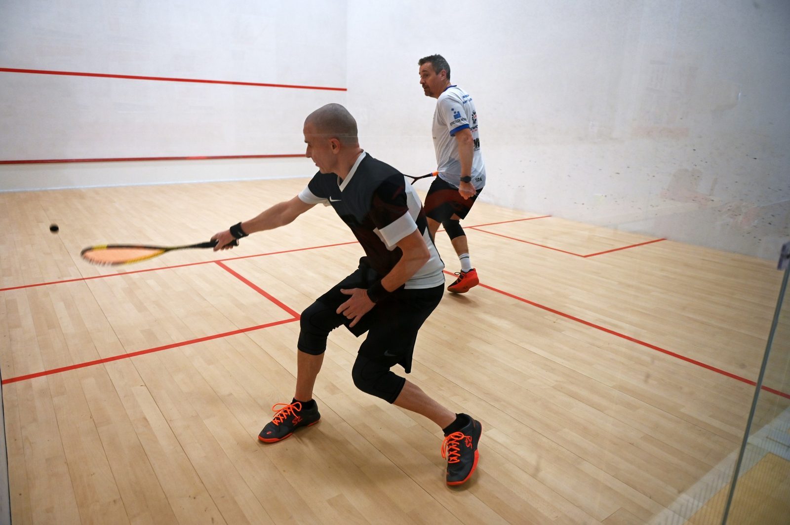 Photo shows two players on court