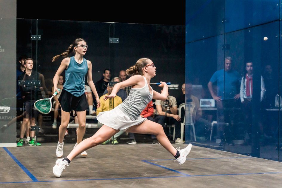 Girls playing on the glass court at Tres Cantos