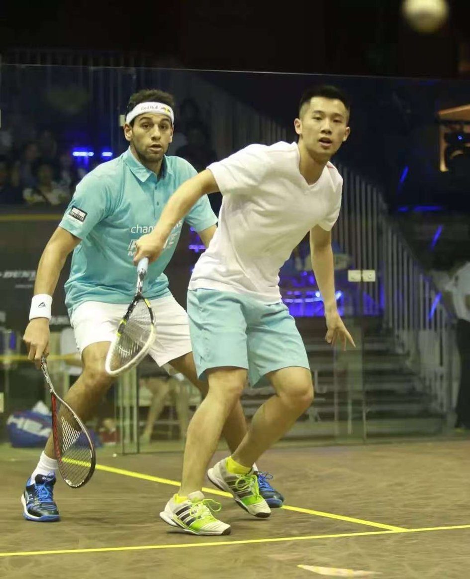 Jack Wang on the court with Mohamed ElShorbagy