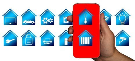 The image shows a hand holding a smartphone with a red screen displaying icons related to home temperature control (a thermometer and a radiator).