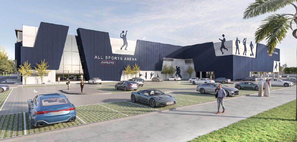 Parking lot with cars outside "All Sports Arena". Blue facade with sports silhouettes. Palm trees and people walking under a sunny sky.