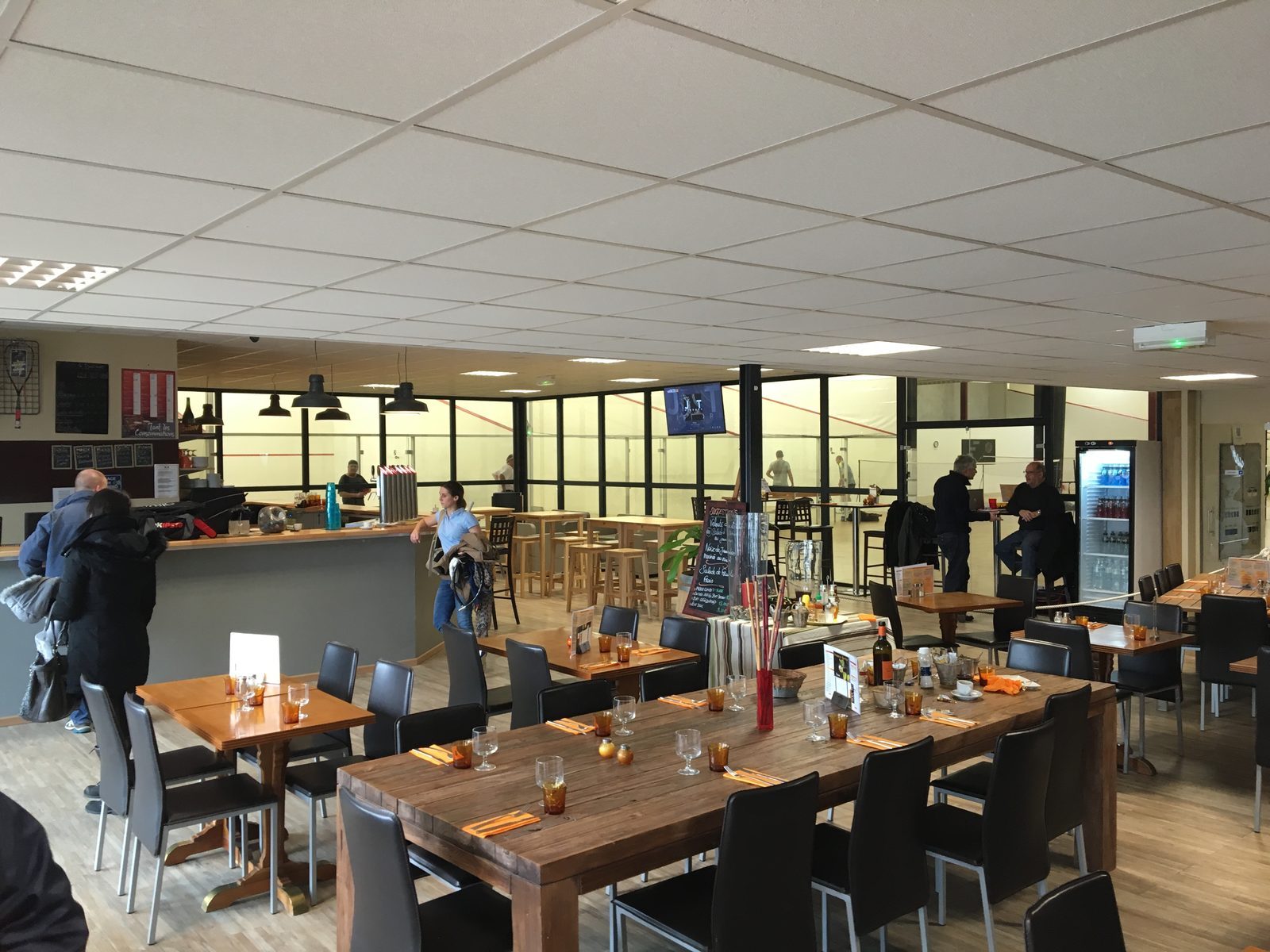The photo shows a bar - the community point of the squash facility