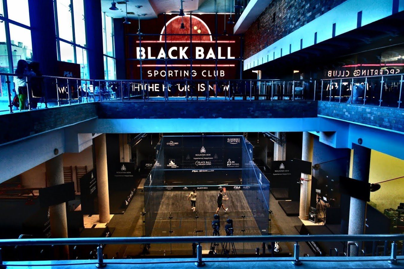 The photo shows the glass court in the Black Ball facility
